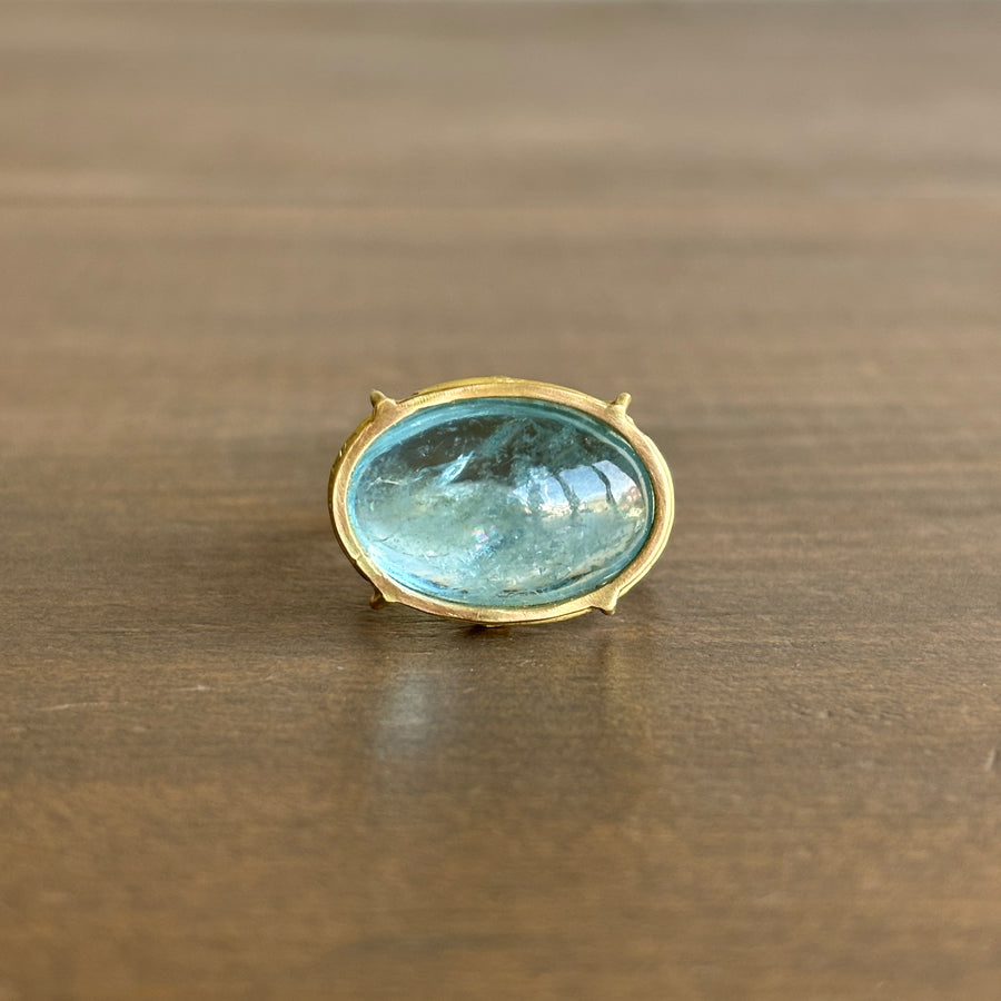 Oval Aquamarine Cabochon Cage Set Ring