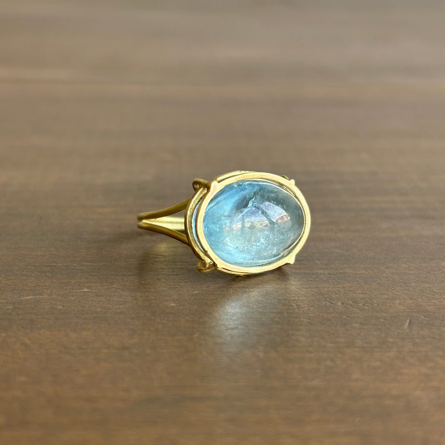 Oval Aquamarine Cabochon Cage Set Ring